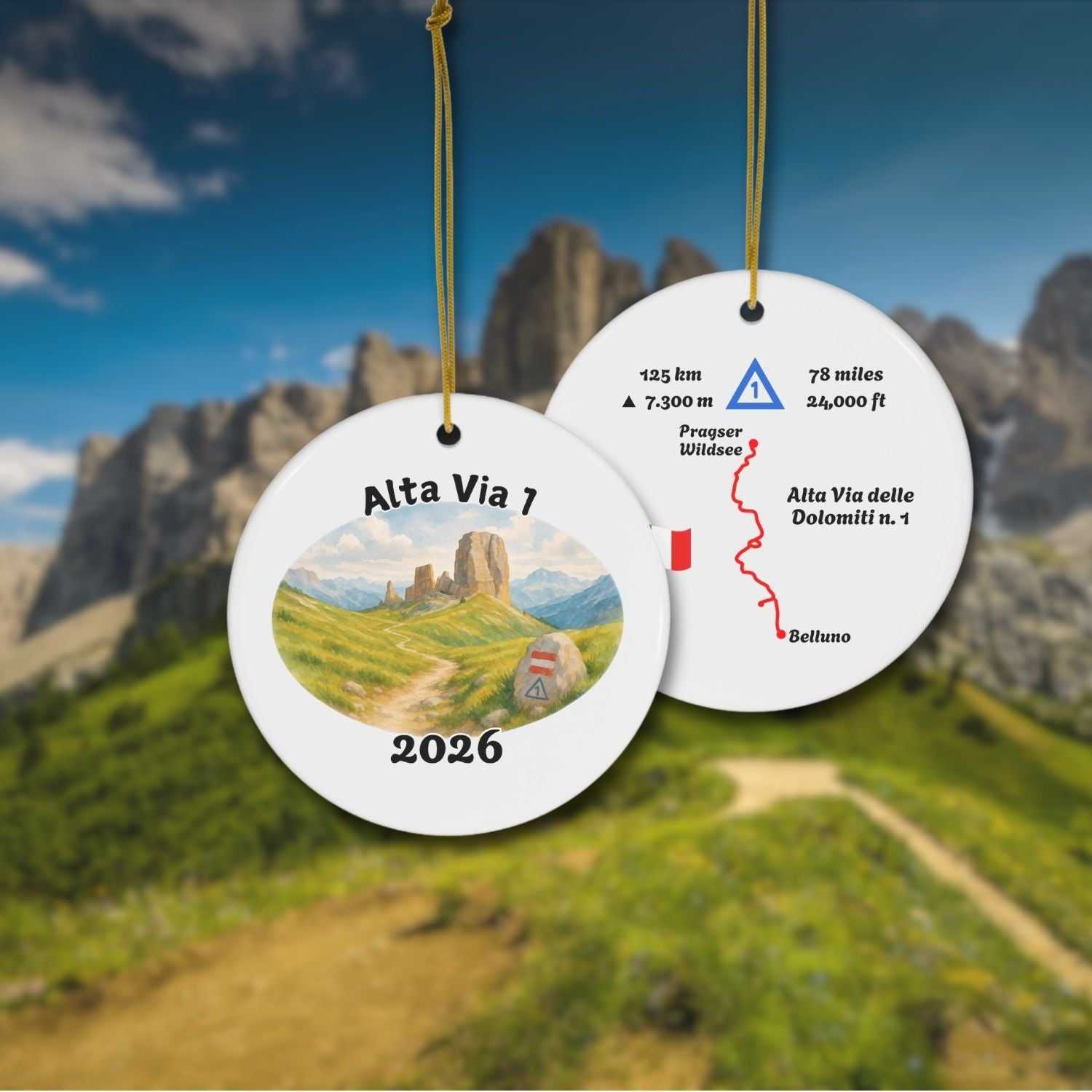 Alta Via 1 personalized trail keepsake ornament hanging with Dolomites background, showing both sides: watercolor landscape front and detailed trail map back.