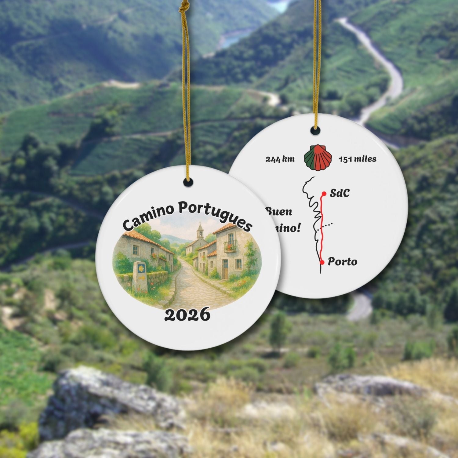 Front and Back of Camino Portugues Ornament Central Trail shown in front of Galician landscape.