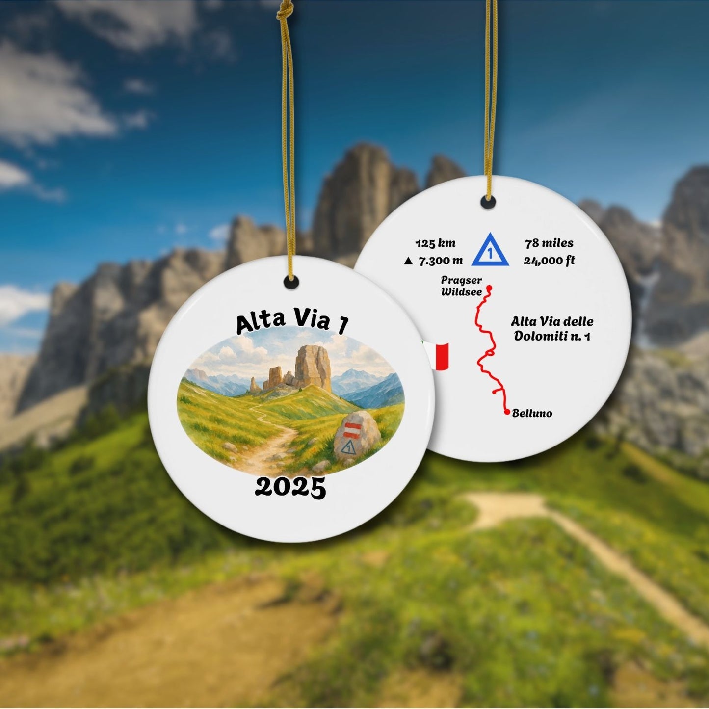 Alta Via 1 personalized trail keepsake ornament hanging with Dolomites background, showing both sides: watercolor landscape front and detailed trail map back.