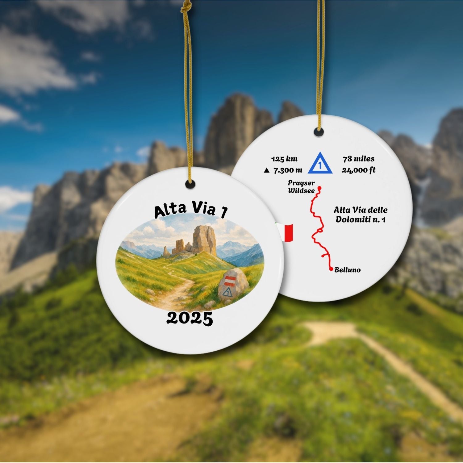 Alta Via 1 personalized trail keepsake ornament hanging with Dolomites background, showing both sides: watercolor landscape front and detailed trail map back.