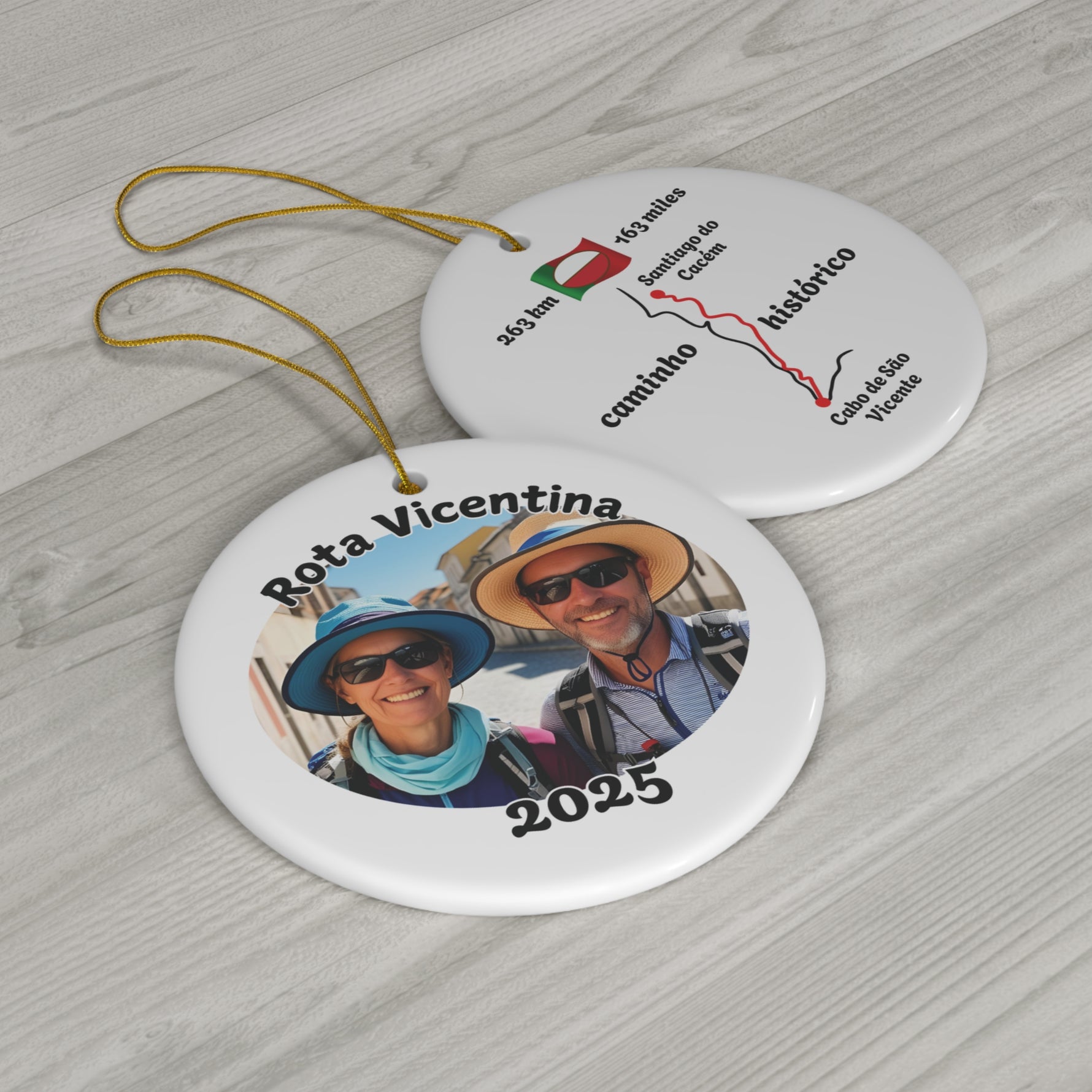 Two circular ornaments with 'Rota Vicentina' design showing front and back of Historical Way trail design on a wooden surface