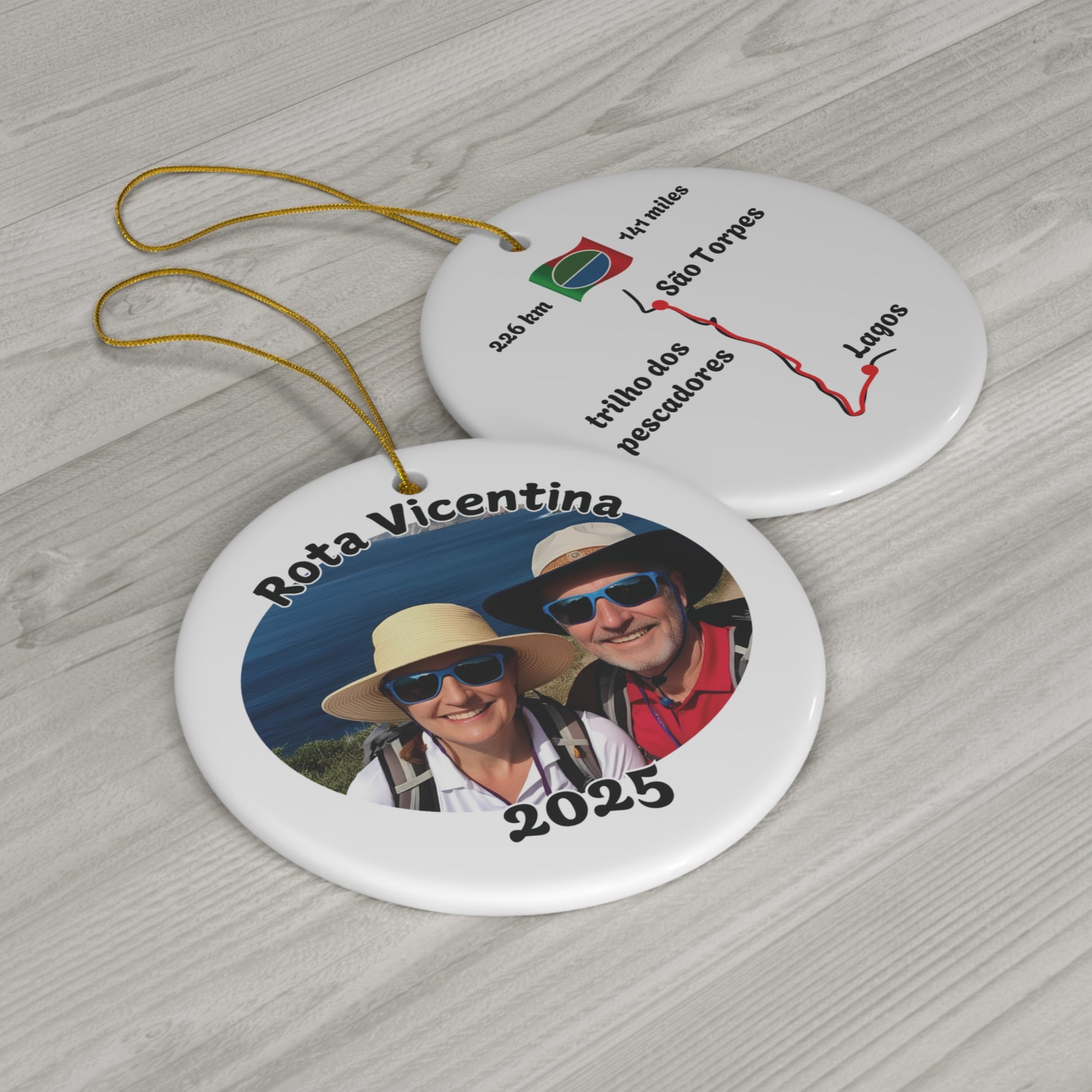 Two circular ornaments with 'Rota Vicentina' design showing front and back of Fishermen's trail design on a wooden surface